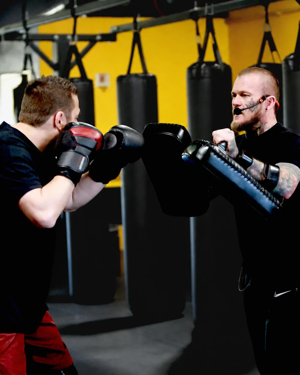 Shaun Anderson coaching pad work during a martial arts session