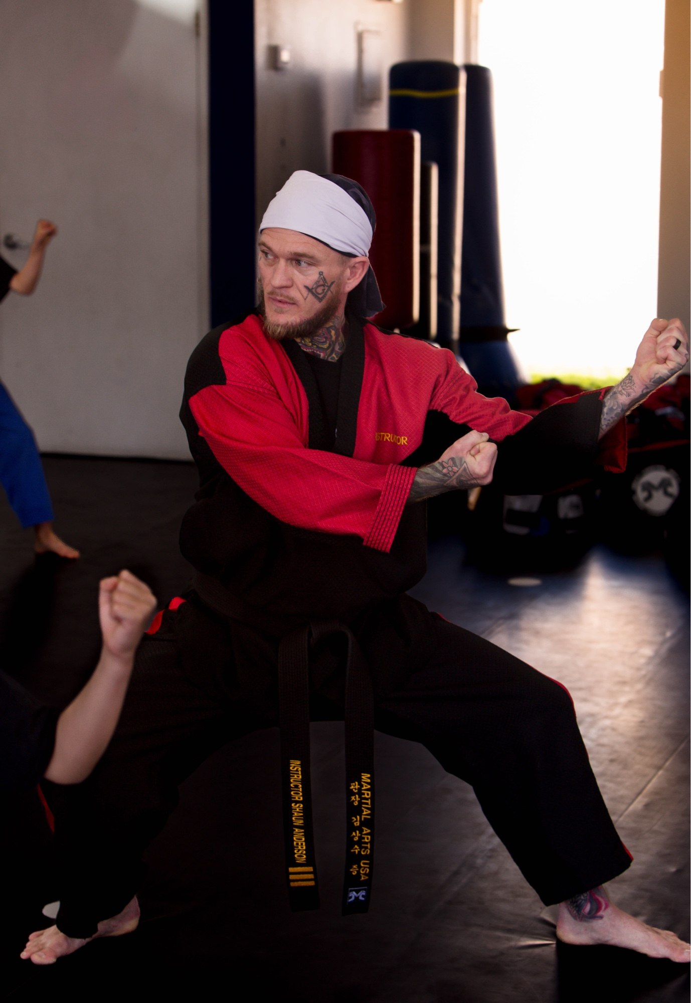 Shaun Anderson as a black belt instructor in a dynamic fighting stance